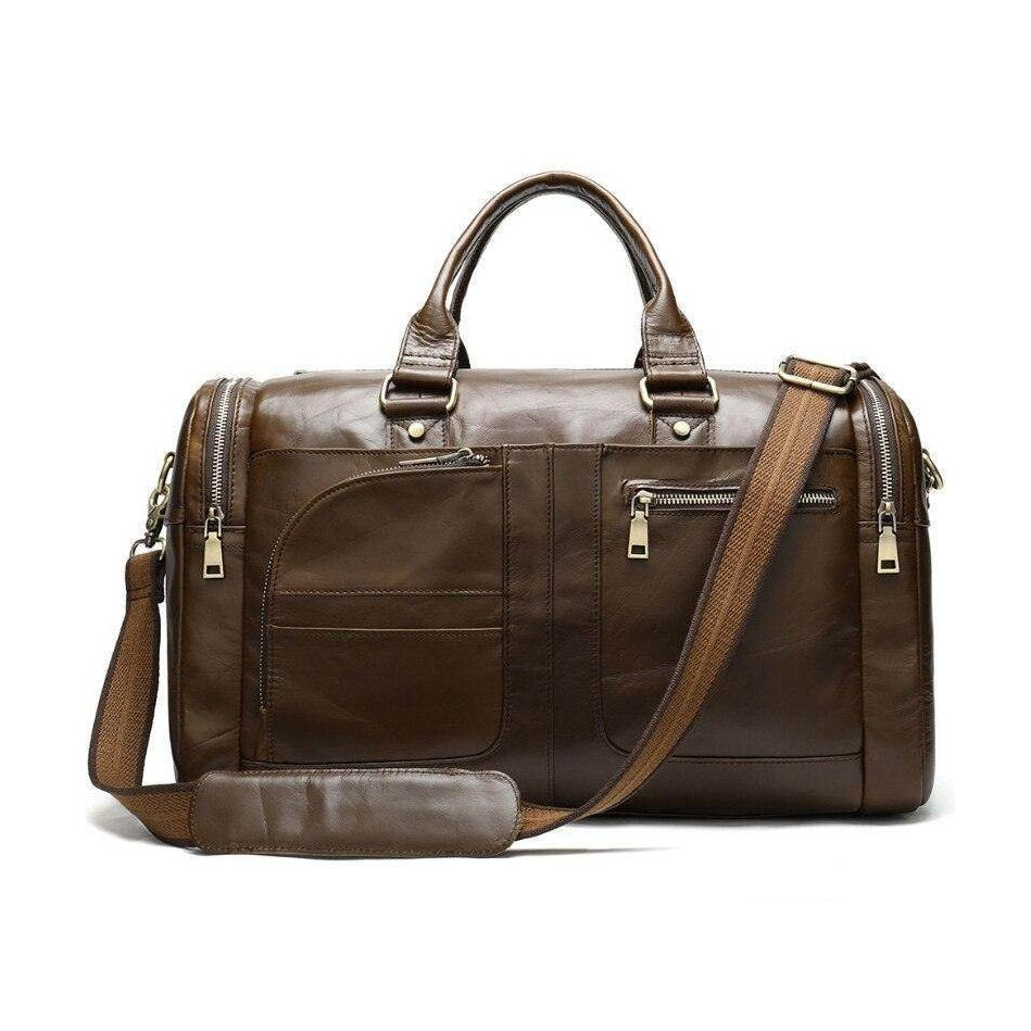 Soft leather travel duffel bag with multiple pockets and detachable shoulder strap in brown