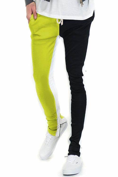 Split track pants for men in vibrant green and black design, perfect for casual wear or workouts