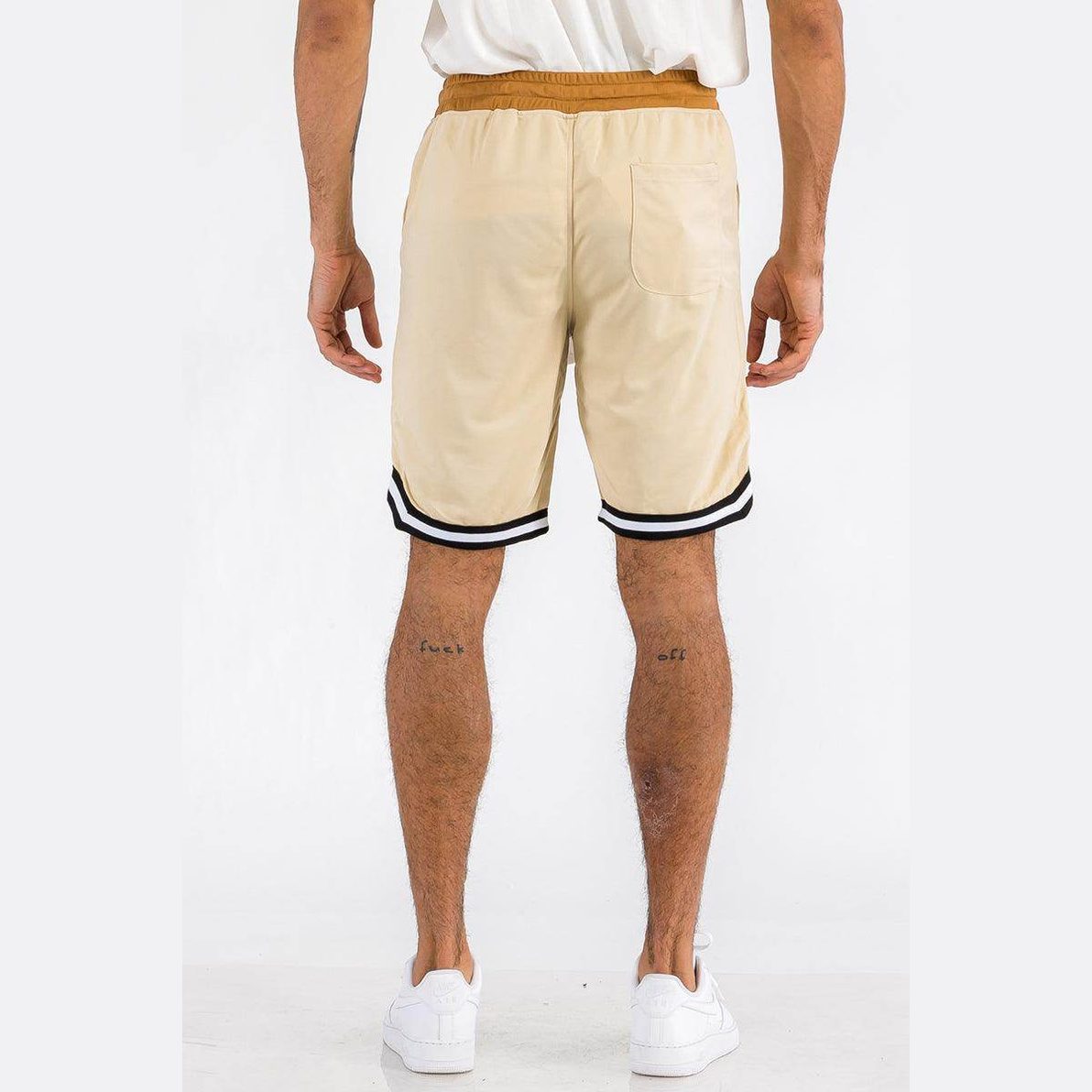 Men's striped active Jordan shorts in beige with black and white stripe detailing on sides