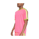 Men's striped short sleeve shirt in vibrant pink with contrasting lime green accents