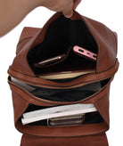 Interior view of a Pink Orpheus stylish backpack handbag with organized compartments for accessories