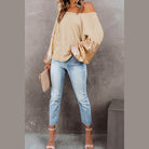 Trendsi stylish vacation blouse with off-shoulder design and sequin sleeves, paired with jeans