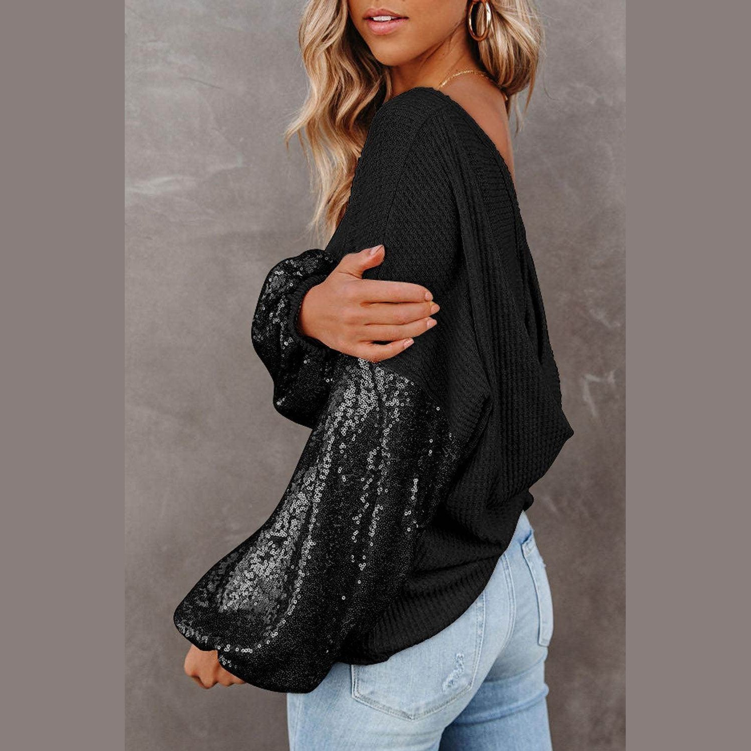 Trendsi stylish vacation blouse featuring a black design with sequin accents and oversized sleeves