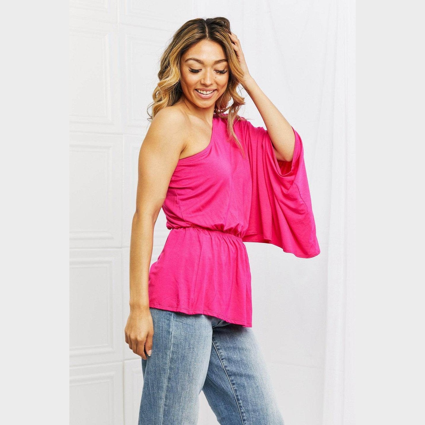 Trendsi stylish vacation tops in pink featuring one shoulder design and flowing sleeves