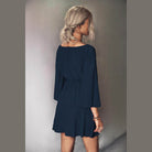 Trendsi women's tie neck vacation dress in dark blue featuring bell sleeves and a flowing silhouette
