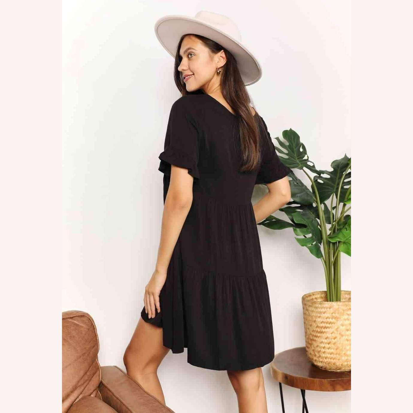 Trendsi tiered summer dress in black with short sleeves and a relaxed fit, perfect for warm weather