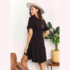 Trendsi tiered summer dress in black with short sleeves and a relaxed fit, perfect for warm weather