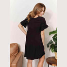Trendsi Women's Tiered Summer Dress in Black, featuring short sleeves and a relaxed fit