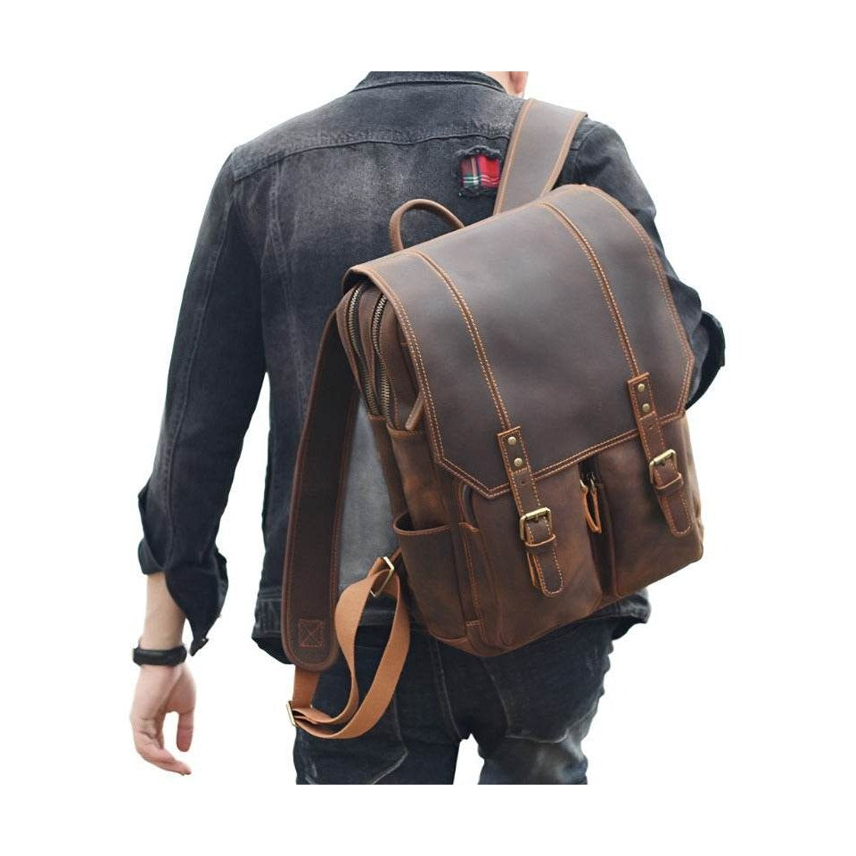 Stylish travel leather backpack with adjustable straps and multiple pockets for convenience
