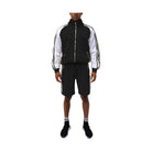 Trendy mens summer outfit featuring a black and white 2PC track set with zip-up jacket and shorts