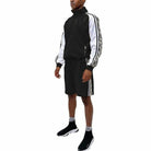VacationGrabs trendy mens summer outfit featuring a black 2PC track set with stylish accents