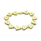 Triangle charm gold bracelet featuring shiny triangular charms with sparkling accents