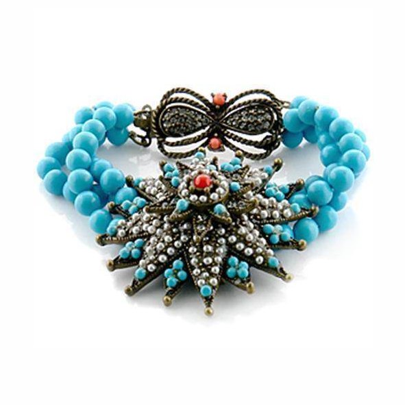 Turquoise and copper statement bracelet featuring intricate design and vibrant colors for a bold look