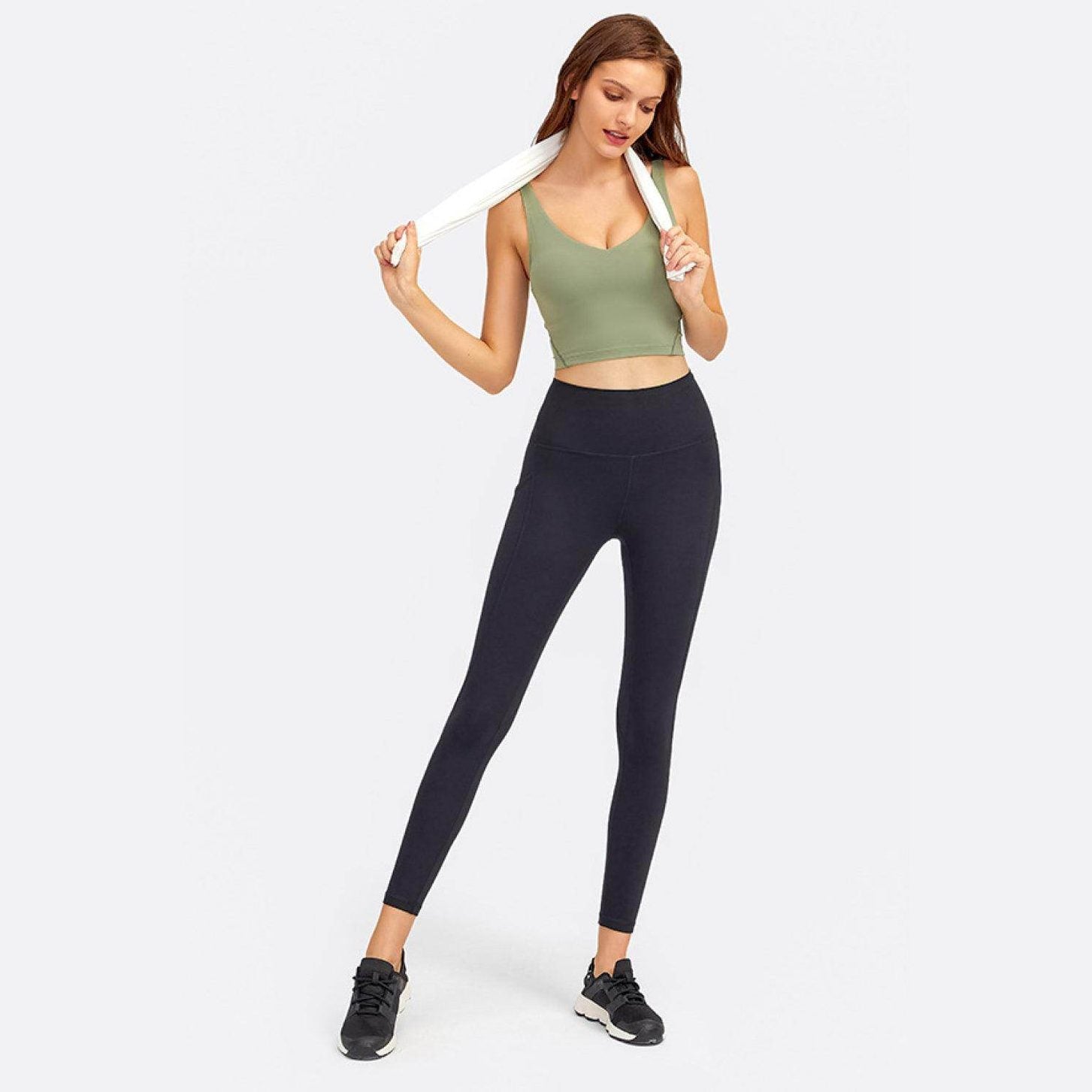 Trendsi women's activewear featuring vacation style sportswear with a green crop top and black leggings