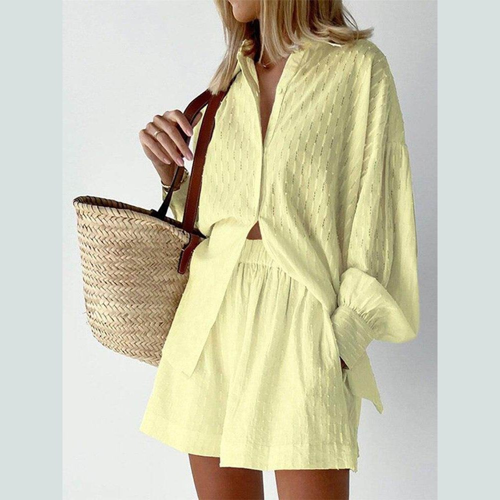 Stylish women's lantern sleeve shirt and shorts set in light yellow for a trendy summer look