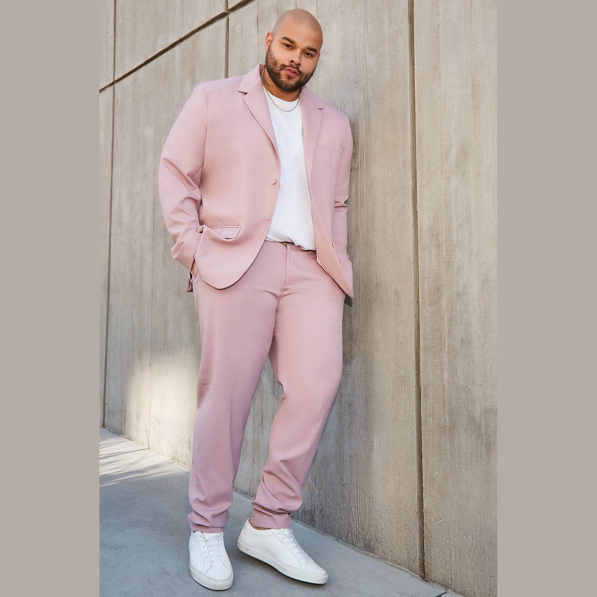 Fashion Nova men's vacation style jacket in pink paired with matching pants for a trendy look