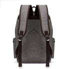 Gray vintage canvas travel backpack with padded straps and spacious compartments for easy carrying