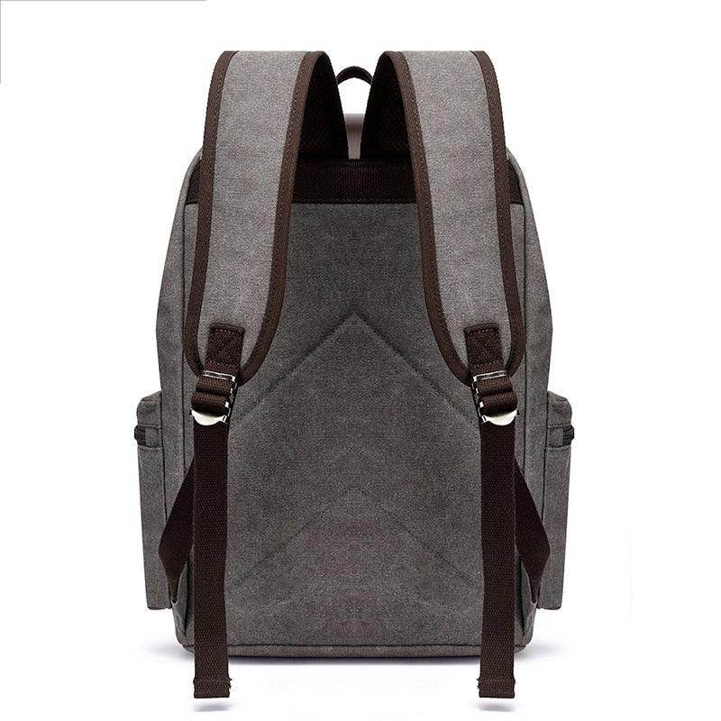 Gray vintage canvas travel backpack with padded straps and spacious compartments for easy carrying