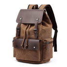 Vintage canvas travel backpack with leather accents and multiple pockets for convenient travel