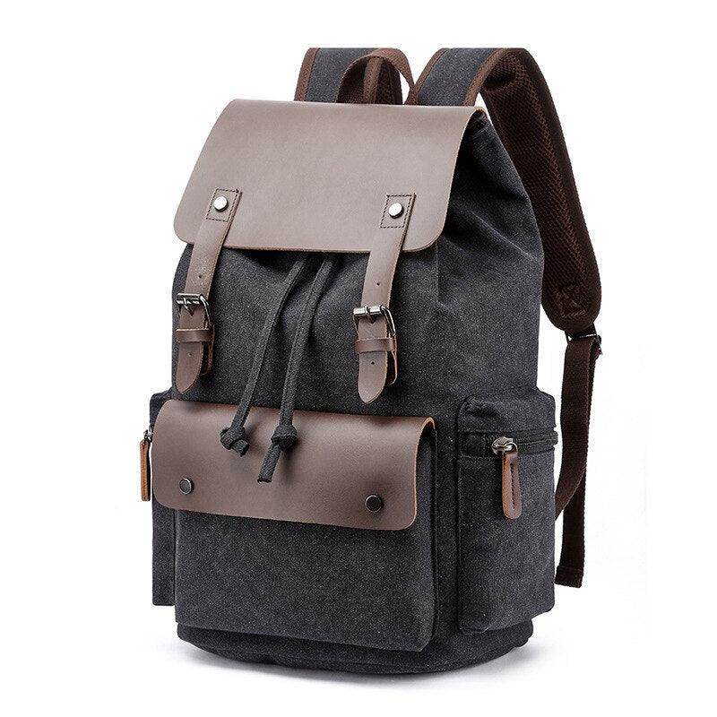 Vintage canvas travel backpack with leather accents and multiple pockets for convenient storage