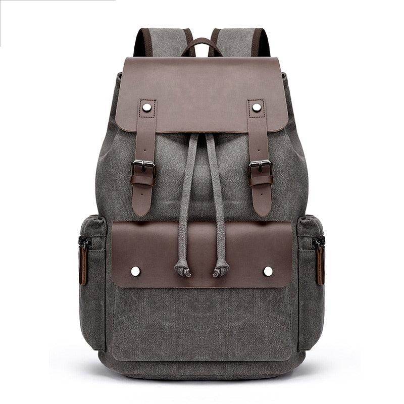 Vintage canvas travel backpack with leather accents and multiple pockets for easy packing