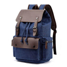 Vintage canvas travel backpack with brown leather accents and multiple pockets for easy organization