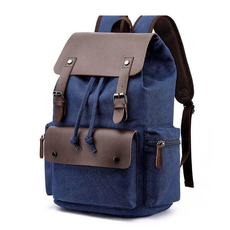 Vintage canvas travel backpack with brown leather accents and multiple pockets for easy organization