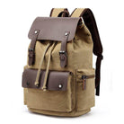 Vintage canvas travel backpack in tan with leather accents and multiple compartments for adventure seekers