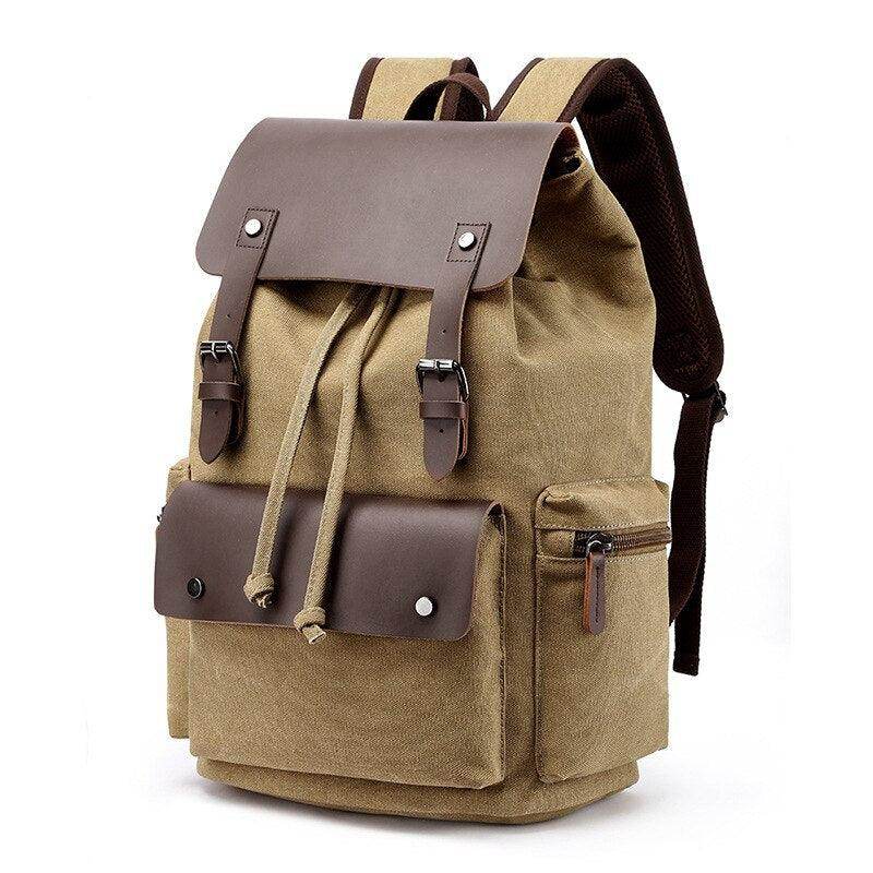 Vintage canvas travel backpack in tan with leather accents and multiple compartments for adventure seekers