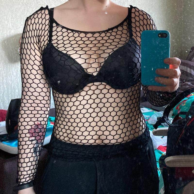 Black womens fishnet top featuring long sleeves designed for a stylish layered look