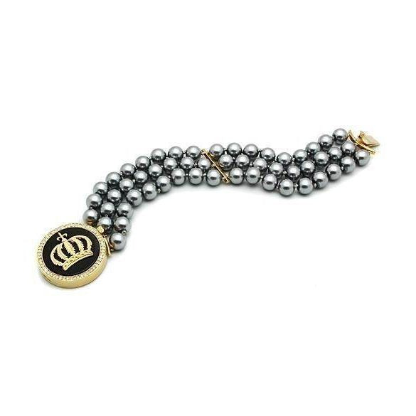 Elegant women's gold brass bracelet adorned with black beads and a crown charm from VacationGrabs