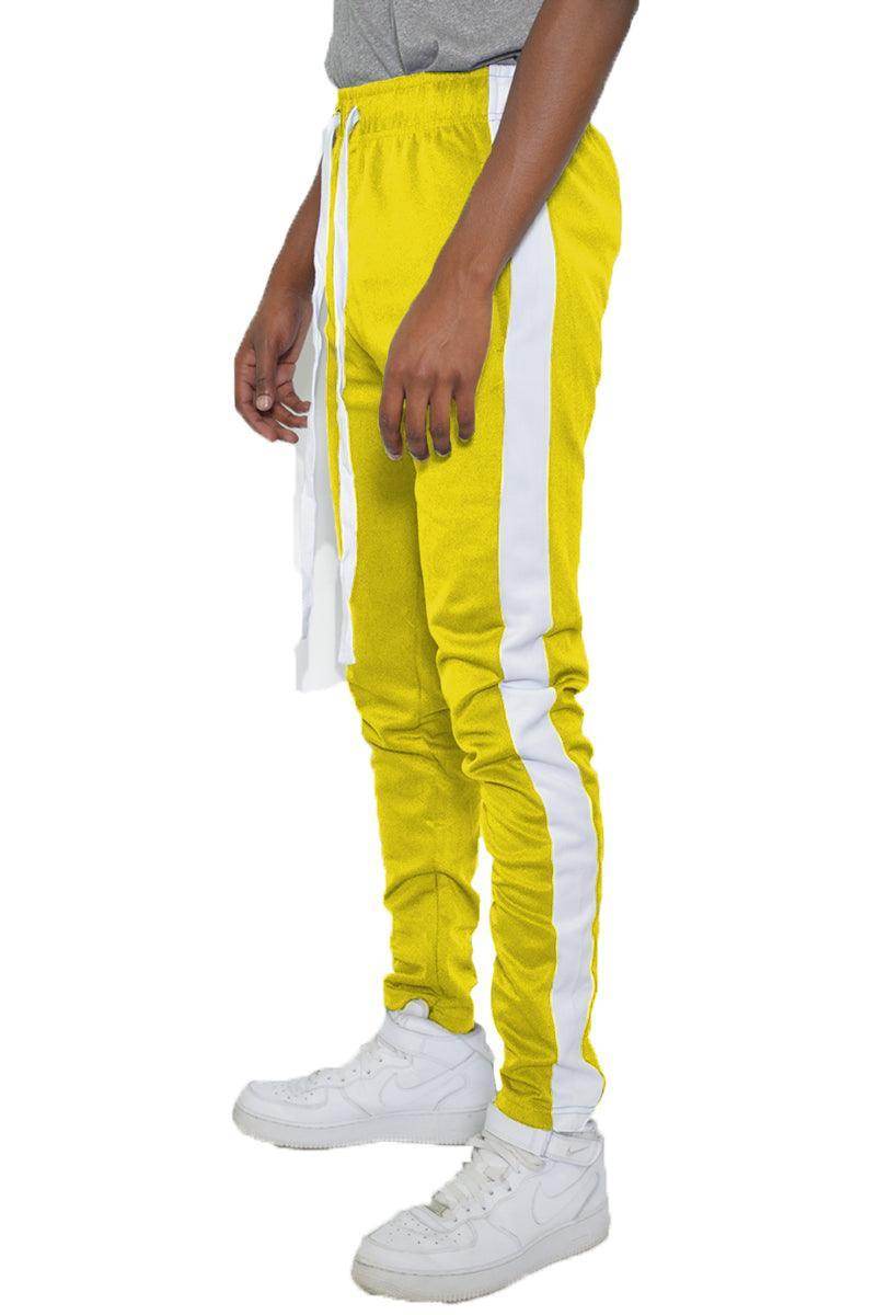 VacationGrabs yellow slim fit track pants with white side stripes, ideal for stylish athletic wear