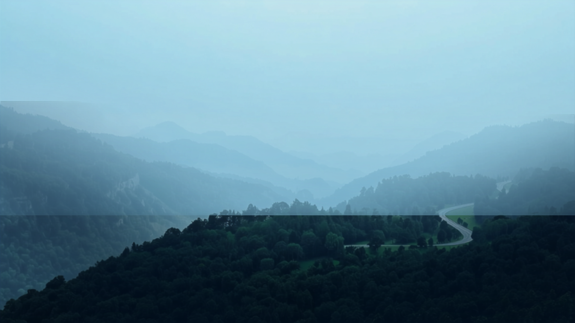Blue Ridge Parkway winding through misty layered mountain ridges