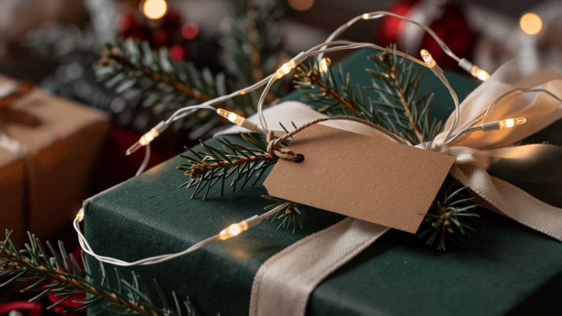 Close-up of string lights and a wrapped gift with a luggage tag