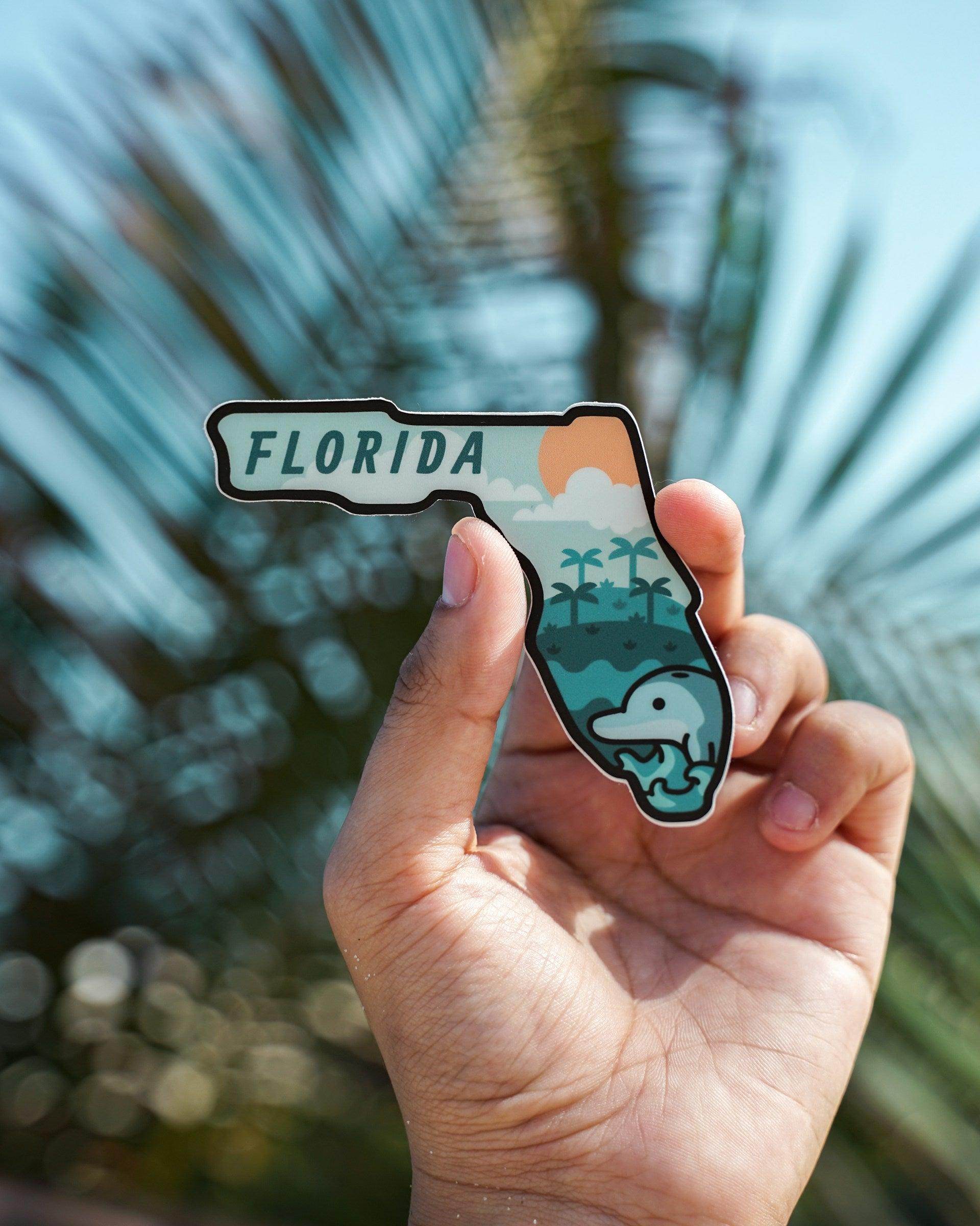 Stylish sticker of Florida with palm trees, ocean waves, and dolphin representing cheap things to do in Orlando