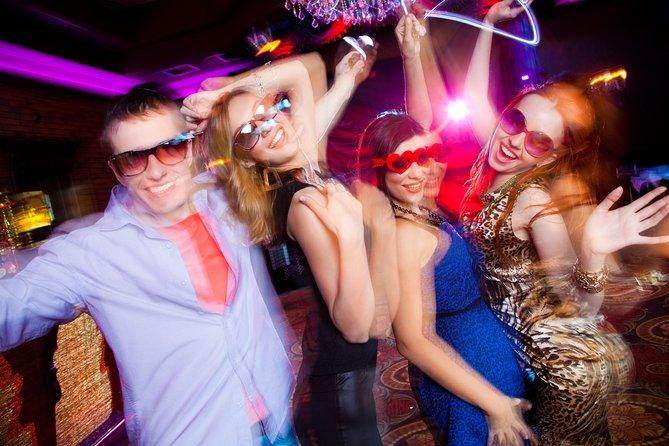 Group of friends enjoying a lively night out, showcasing affordable Las Vegas vacation fun