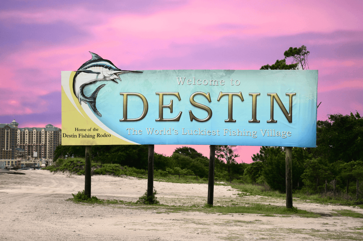 Welcome sign at Destin Beach highlighting must-do activities and fishing village charm