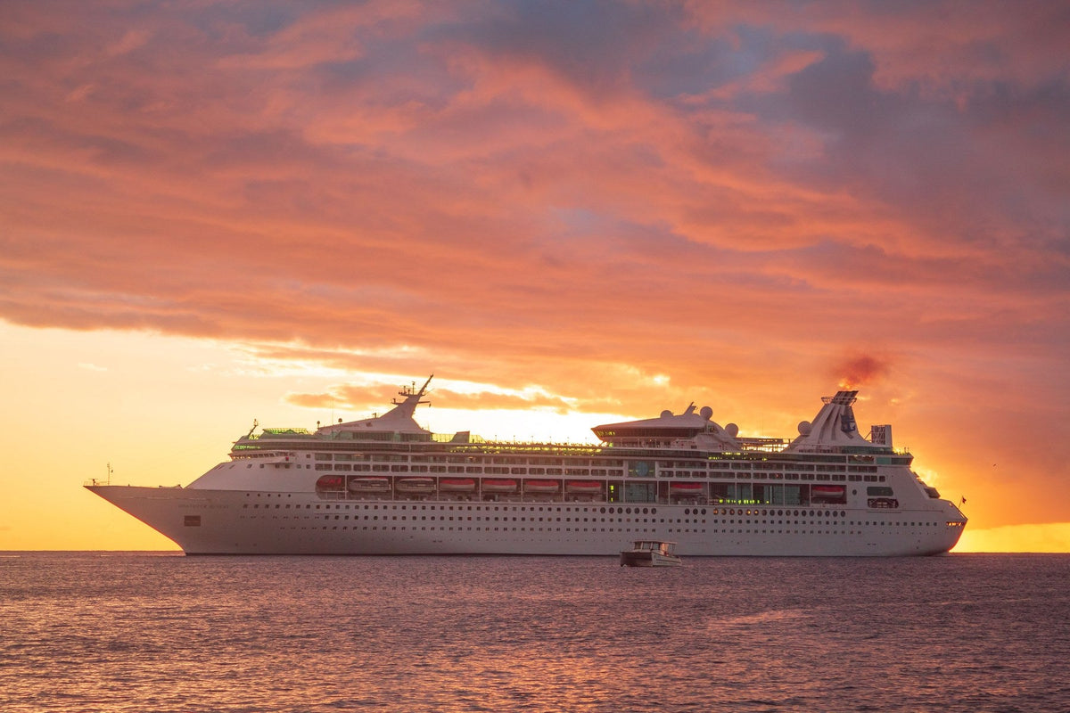Cruise ship at sunset on the open water in the Caribbean