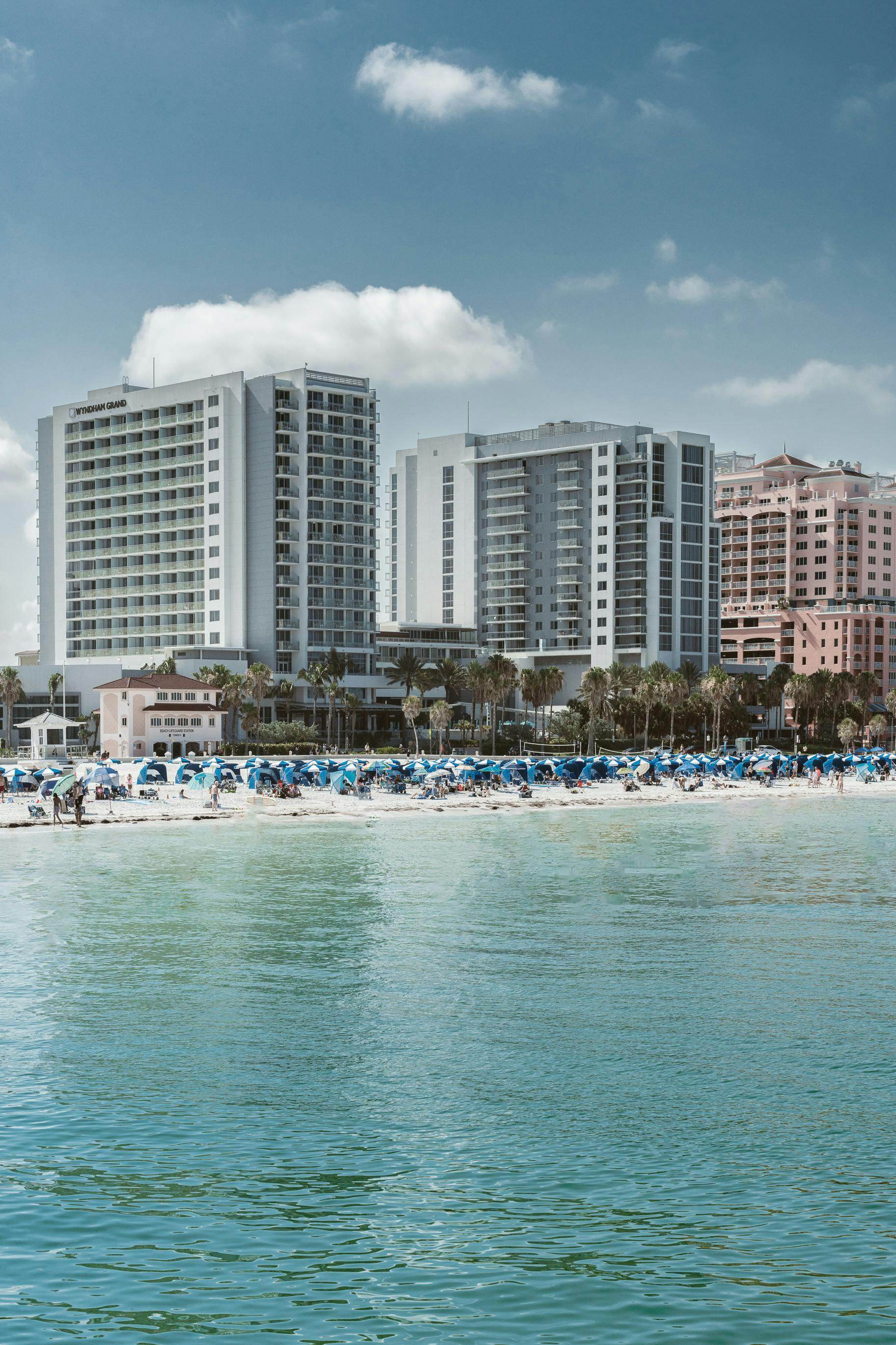 Scenic view of best beaches near Orlando with hotels and beachgoers enjoying the sun