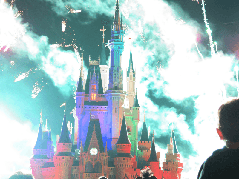Disney Castle with Colorful Fireworks Display, Perfect for Orlando travel on a budget