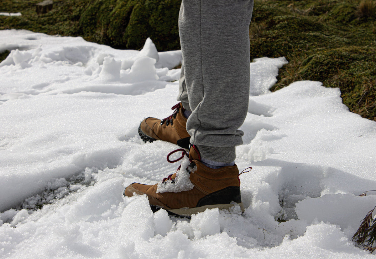 Insulated snow boots standing in deep snow