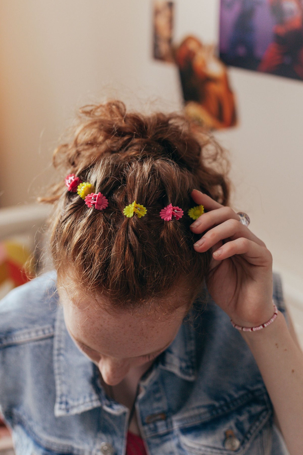 Colorful flower hair clips in curly hair