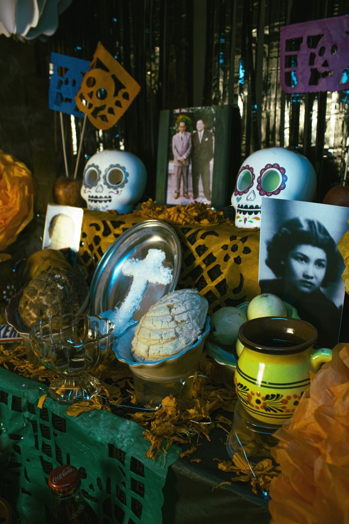 Colorful Day of the Dead altar decorated with marigolds and candles