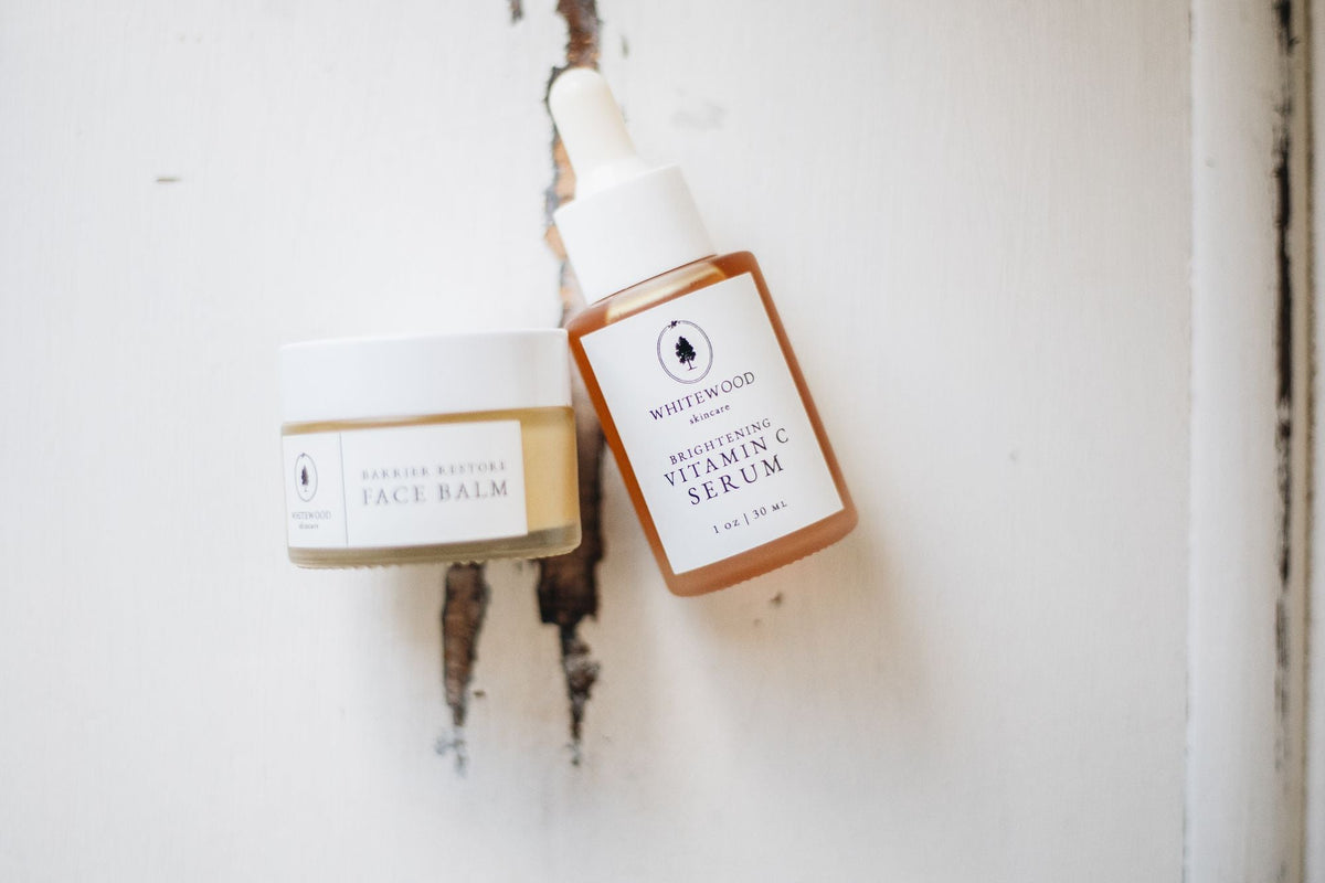 Travel-sized skincare bottles flatlay