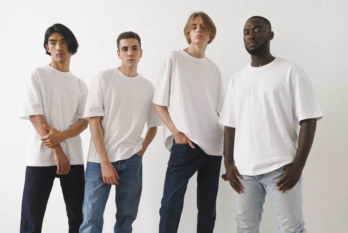 Men posing in plain white t-shirts and jeans