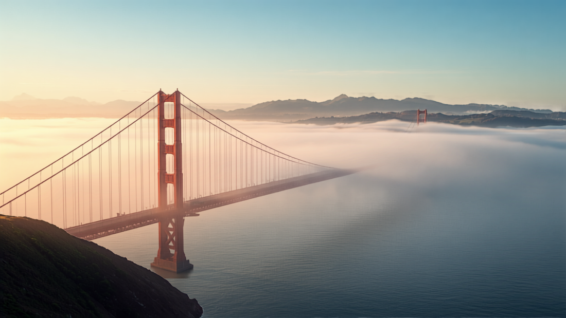 The Golden Gate Bridge emerging from morning fog in San Francisco