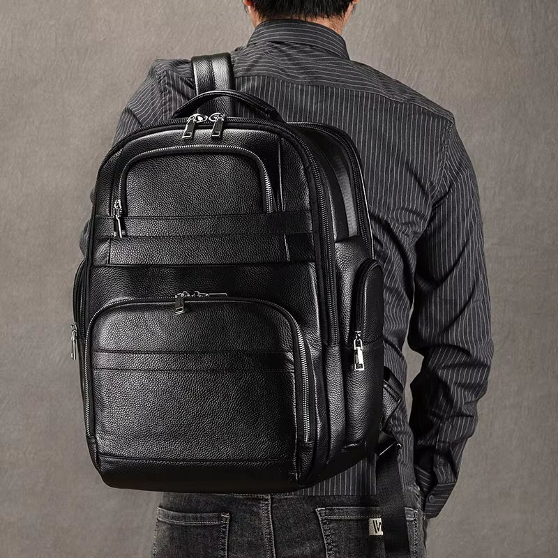 Stylish leather backpacks for daily wear displayed with accessories on a rustic wooden table