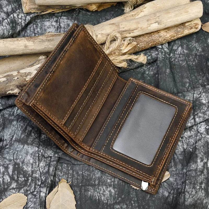 Stylish collection of men's leather wallets displayed on a wooden surface with cash visibly placed