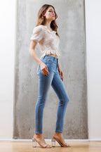 Mid Rise Destructed Skinny Jeans