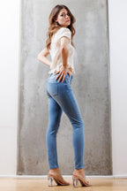 Mid Rise Destructed Skinny Jeans